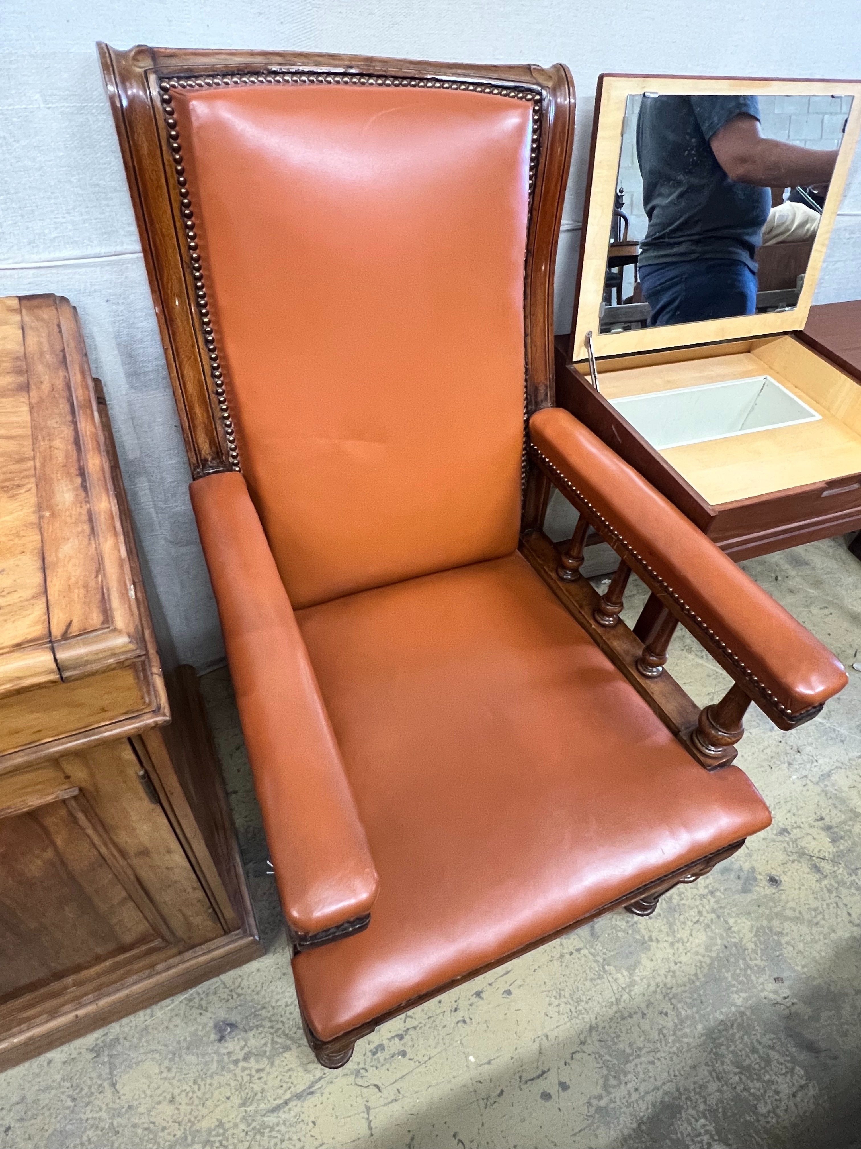 A late Victorian oak and leather library armchair, width 62cm depth 76cm height 110cm
